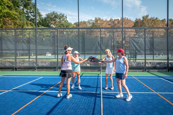 Women playing tennis at Guilford Racquet & Swim Club in Guilford, CT