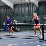 Two women playing pickleball | Guilford Racquet & Swim Club